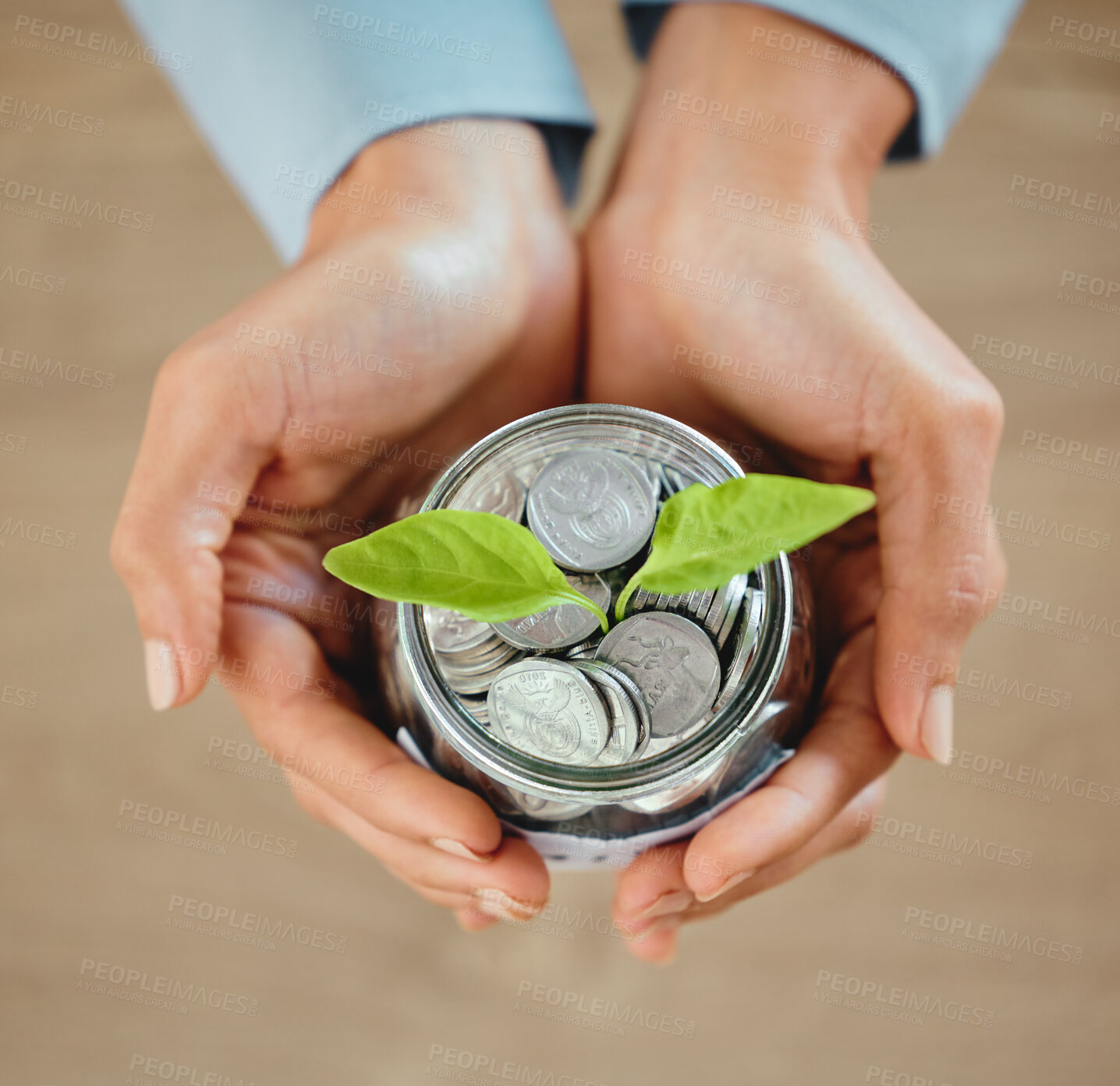 Buy stock photo Top view of money, coins and cash in a jar for savings, budget and future needs. Closeup of the hands of a person holding a jug growing with funds for spending, payment or donation from above