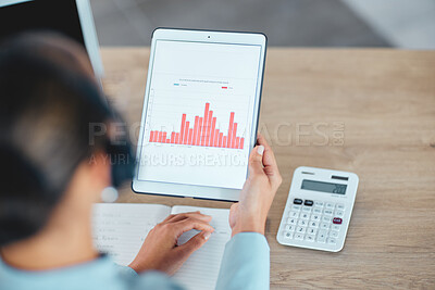 Financial advisor reading, studying and checking finance data charts, graphs and reports on tablet in office. Above view of professional holding, analyzing and calculating profit and loss information