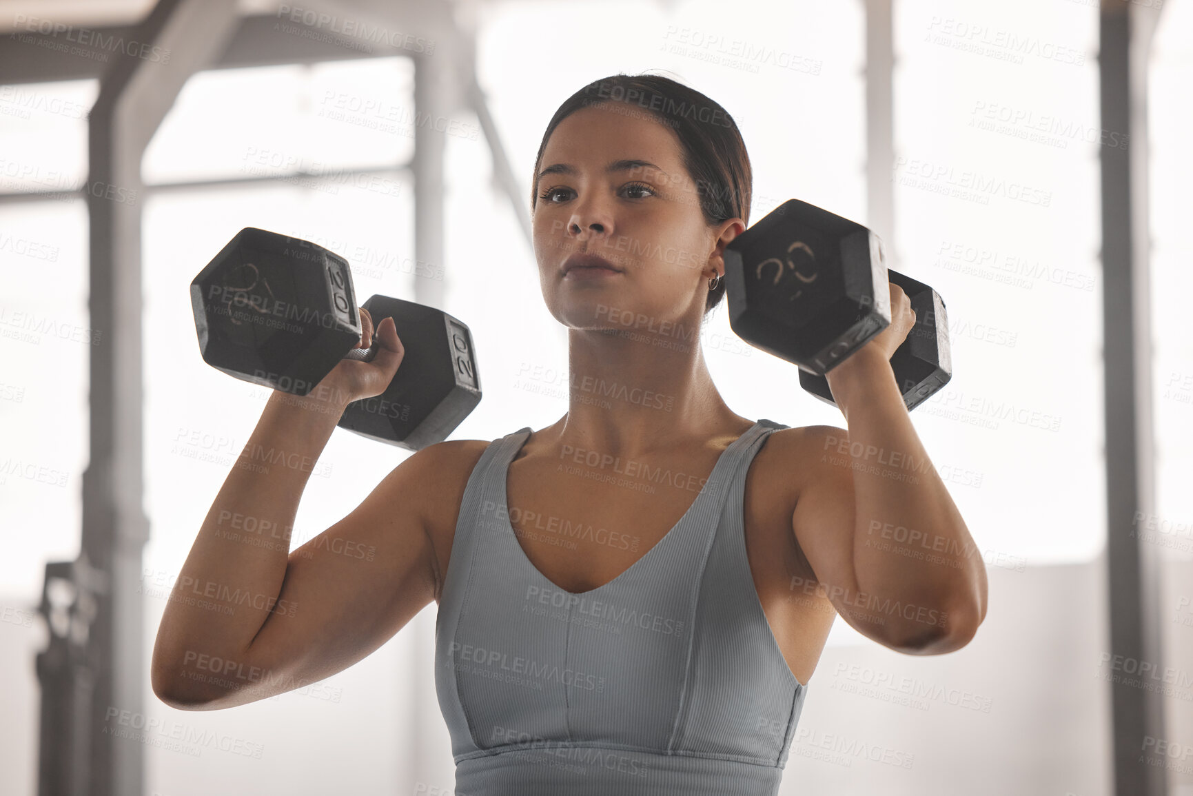 Buy stock photo Fit, active and strong athlete doing arm muscle training and exercises with dumbbells or weights at a gym for a wellness lifestyle. Closeup of sporty female doing strength and endurance workout.