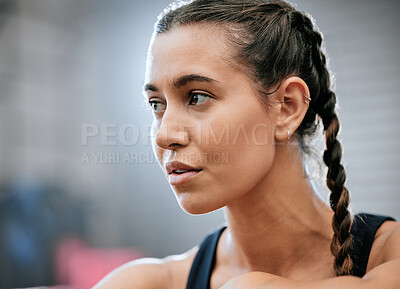 Buy stock photo Confident, serious and healthy young sports woman after her exercise, training and workout routine in the gym. Focused, determined and thinking athlete looking away to health, fitness and lifestyle