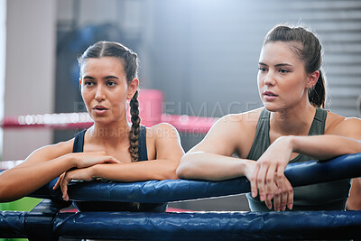 Buy stock photo Active, fit and tired boxing female athletes and friends breathing, resting and taking a break after routine workout at the gym. Sporty, sweaty and dedicated women resting after exercise and cardio