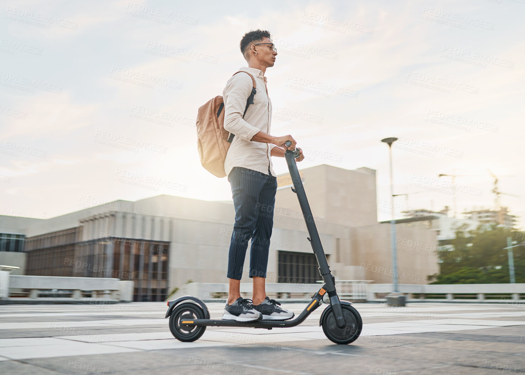 Buy stock photo Young man, riding scooter and eco friendly for emission free future, sustainable and outdoor. Travel, casual business man and driving electric transport in city street, during day commute or journey