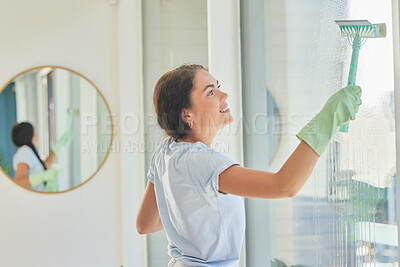 Buy stock photo Woman, window and cleaning service with squeegee, water and soap on glass of home or apartment with bacteria, dirt and dust on surface. Happy cleaner working to clean house for hygiene and wellness