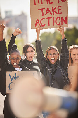 Buy stock photo Woman, protest and billboard of community in the city raising fists for equality, gender based violence or change. Women activist standing together in street march for strike, voice or action message