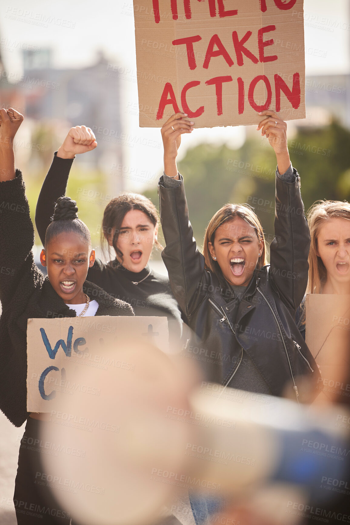 Buy stock photo Woman, protest and billboard of community in the city raising fists for equality, gender based violence or change. Women activist standing together in street march for strike, voice or action message