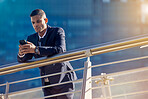 Business, man and phone outside for 5g internet to search or browse social media for media content. Businessman, balcony and cellphone for social network browsing for communication and texting