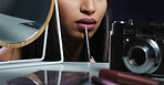 Makeup artist, beauty model or cosmetics influencer applying lipstick on her lips recording with a camera. Closeup of a stylish, trendy and edgy female using facial glamour products