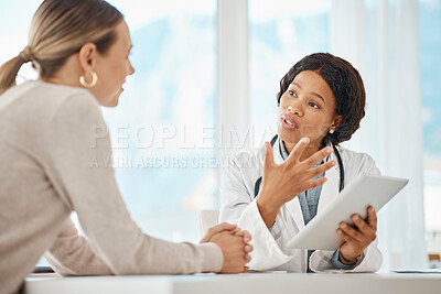 Buy stock photo Female doctor browsing a tablet and giving medical advice to a woman. Surgeon, physician or GP showing patient scan results while explaining, consulting and advising surgery procedure at a hospital