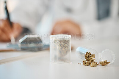 Buy stock photo Medical marijuana grass, medicine and health drug on a table for prescription, healthcare condition and cure for disease at a hospital. Doctor, surgeon or expert gp writing remedy script for cannabis