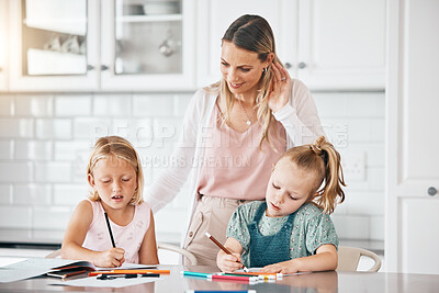 Buy stock photo Homework, education and learning during homeschool lesson with their mother on the kitchen counter. Cute little girls doing educational drawing with color pencils assistant or help from their mom