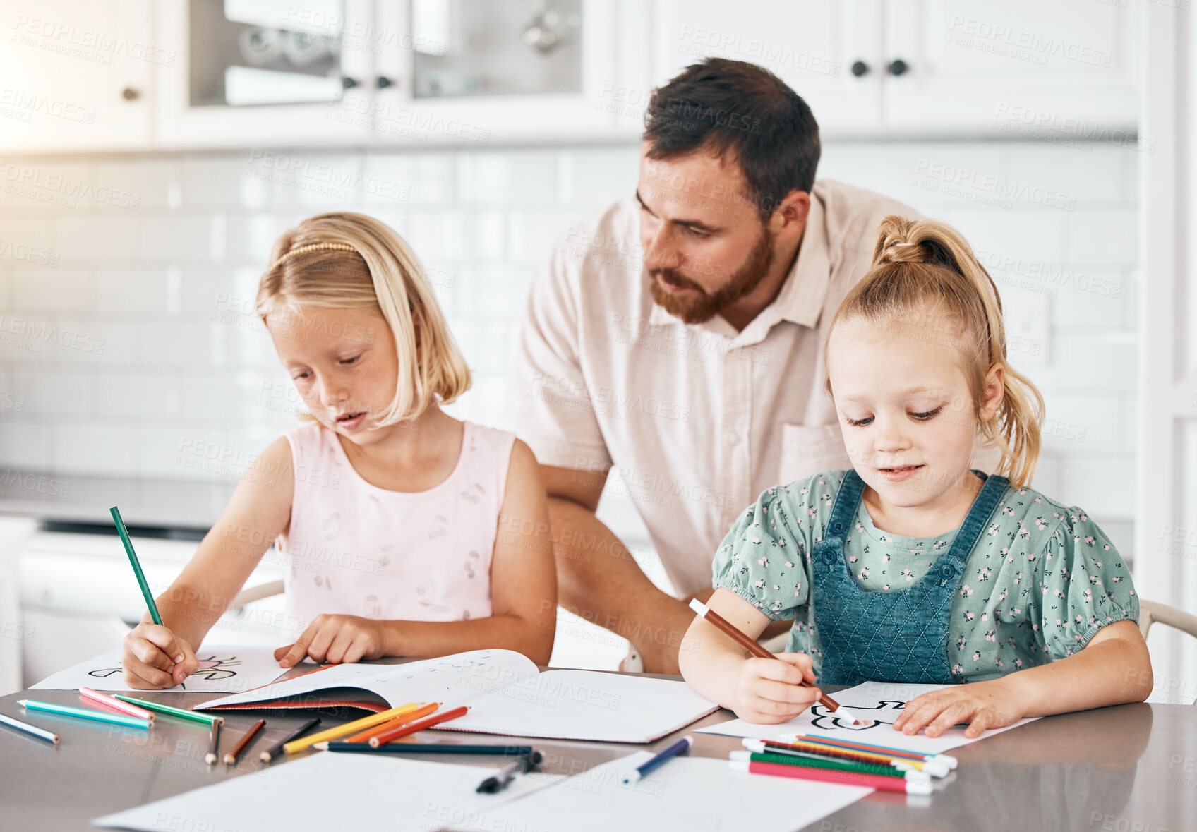 Buy stock photo Education, learning and homework with a little girl, her sister and her dad drawing, writing or coloring in the kitchen at home. Single father helping, assist and teaching his daughters about school