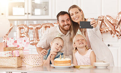 Buy stock photo Family birthday party in kitchen, mom photograph on phone camera for social media and mother and father celebrate. Gifts, cake, food and foil balloons at home with dad and twin sisters.