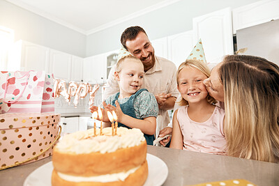 Buy stock photo Family birthday party, smile in home kitchen, happy mother kiss girl child, children love fun quality time together and bond over bake cake and food. Kid look at the camera of happiness in house.