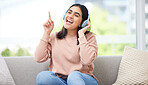 Singing and listening to music or audio with headphones musician and vocal student streaming songs at home. Young, creative and happy woman can sing song after practicing from melody and sound