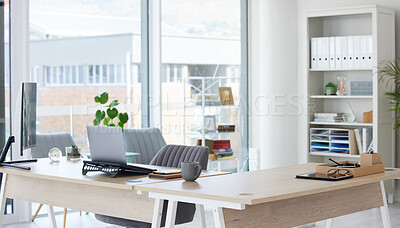 Buy stock photo Clean, bright and empty home office interior organized with a computer and desk inside. Modern, contemporary and work space view of a decorated room with stylish decor and wooden furniture indoors