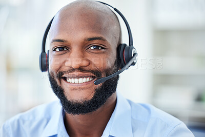 Buy stock photo Portrait of male call center agent with a headset working in a corporate office doing crm. Cheerful, young and African ecommerce customer service representative or support hotline operator at work.
