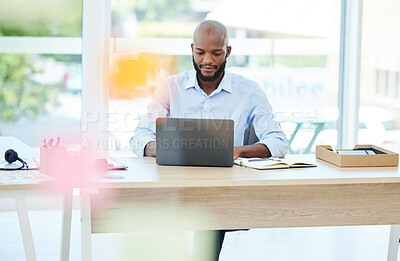 Buy stock photo Designer, business man and young creative working, planning and typing ideas, strategy and research on laptop in a startup agency. Organized and busy marketing professional working on online project