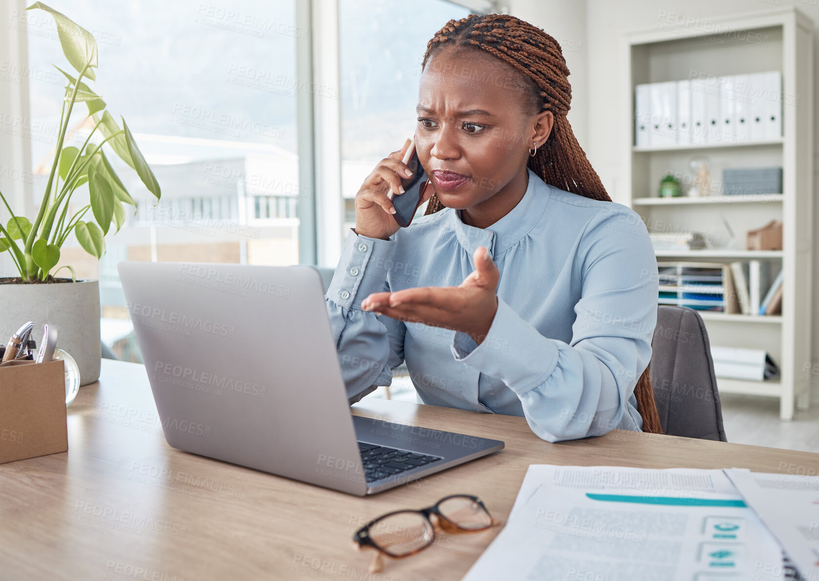 Buy stock photo Angry, phone and stressed black woman on a business call about tax, audit and compliance email on laptop at office desk. Employee working mad, internet and tech glitch on the website of the company