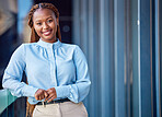 Corporate business woman standing on balcony outside at work, taking a break and looking confident. Portrait of a professional, smiling and cheerful black female manager expressing leadership