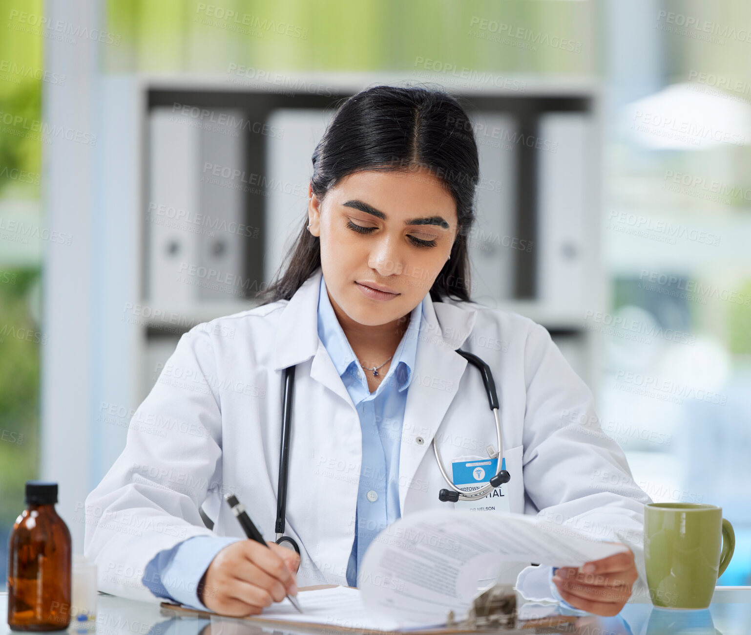 Buy stock photo Doctor, healthcare worker and gp reading, writing and planning test results, patient record and medical research in a hospital or medical clinic. Organized healthcare expert working on treatment plan