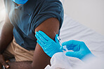 Closeup vaccine, injection and medicine for covid, monkeypox or ebola with doctor, healthcare or medical professional. Frontline worker in using syringe or needle to inject clinic or hospital patient