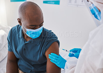 Buy stock photo Vaccine, injection and virus cure for covid, disease and pandemic illness from doctor, healthcare or medical professional. Male patient with mask being injected in arm by hazmat suit frontline worker