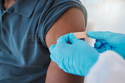 Buy stock photo Corona, compliance and the vaccine being given to man by a health care worker. Closeup of a nurse putting a plaster on a man after an injection or treatment. Male making decision to get booster shot