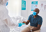 Man talking to medical doctor, wearing mask to protect from covid and getting healthcare advice. Expert, professional or healthcare worker consulting with patient and giving brochure at hospital