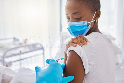 Buy stock photo Vaccine, medicine and covid injection at a clinic by a young black woman wearing a covid19 mask. Ill, sick or unhealthy young female getting flu shot or coronavirus treatment at a hospital