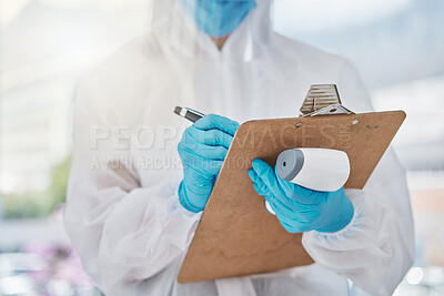 Buy stock photo Doctor writing covid safety report with laser thermometer for fever symptom of virus, sick or illness with patient information notes at mobile vaccine clinic. Healthcare worker for medical wellness