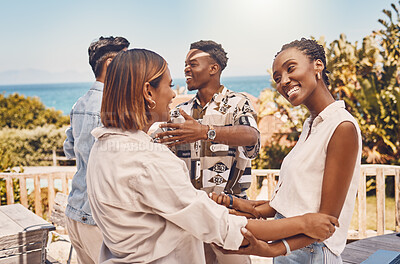 Buy stock photo Friends, hugging and looking happy while meeting outside a restaurant. Diverse couples talking and greeting while on a double date. Friendly women and men embracing while having fun at a gathering