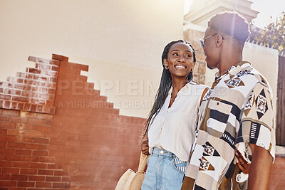 Buy stock photo Happy, love and relax couple walking in city on a date together on their getaway break. Summer, travel and smile with young black man and woman holding hands in the street of their vacation trip
