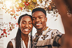 Selfie of happy black woman and man couple in love on outdoor date. Girlfriend and boyfriend smile, photographs  memory together on mobile smartphone and share online internet with friends and family