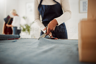 Buy stock photo Fashion designer and tailor cutting fabric and making or preparing pattern for stylish, trendy and fashionable clothes. Workshop or boutique seamstress using denim material or textile for edgy wear