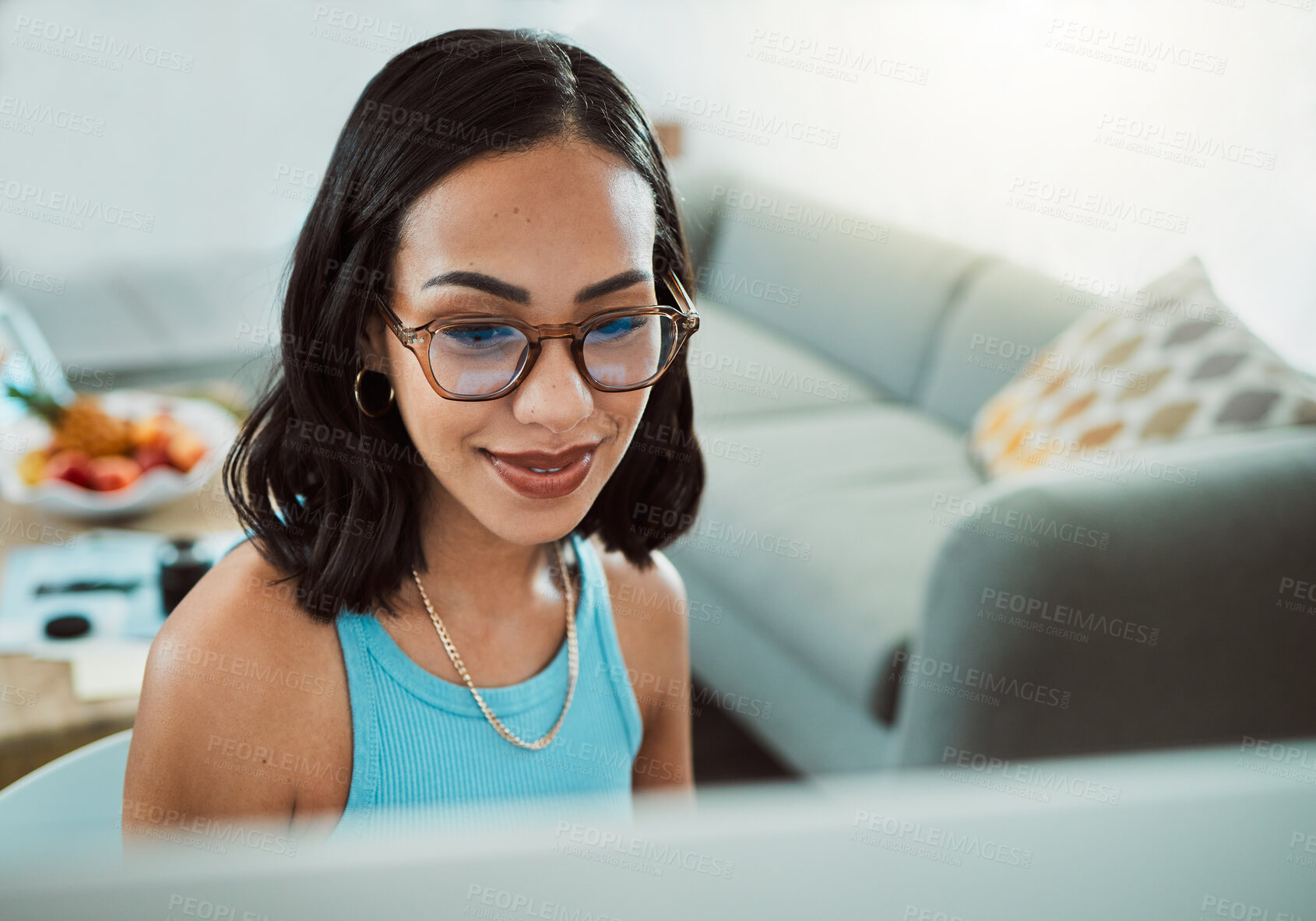 Buy stock photo Confident young female worker with spectacles, working from home office alone in virtual team meeting. Professional freelance entrepreneur, trendy cool workspace, watching tv series in lockdown.