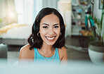 Call center, customer service and sales support with a female agent or representative wearing a headset and remote working from home. Portrait of a young woman helping, assisting or talking on a call