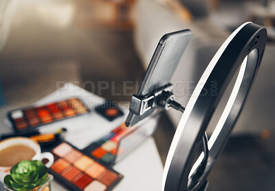 Buy stock photo Beauty blog, cosmetics and phone stand of a social media makeup vlogger ready for shooting a video. View of influencer equipment and products ready for live streaming a tutorial for web content