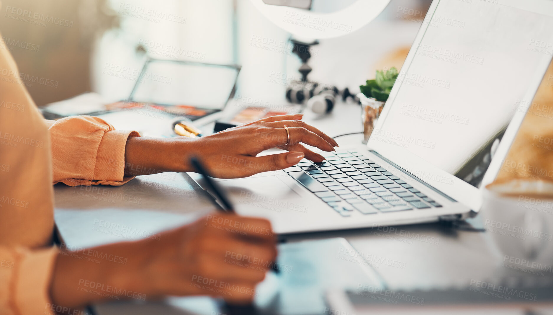 Buy stock photo Graphic designer, blogger and young entrepreneur working on a laptop while designing a logo or website while drawing with a digital stylus pen. Hands of a creative woman using modern digital tools