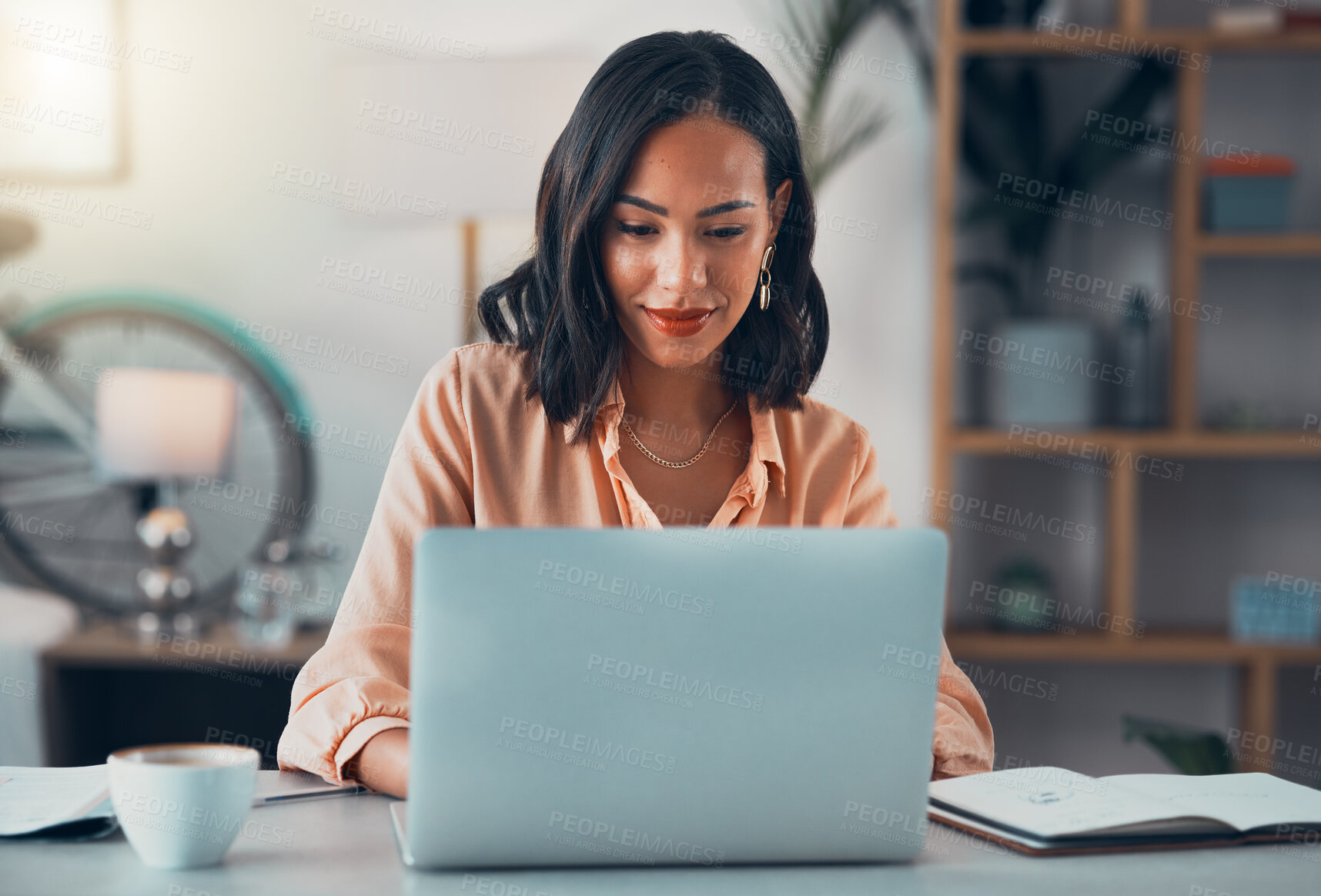 Buy stock photo Woman working on laptop online, checking emails and planning on the internet while sitting in an office alone at work. Business woman, corporate professional or manager searching the internet