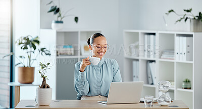 Buy stock photo Small business owner, startup manager or entrepreneur working on a laptop in her office and drinking tea. Young business woman reading, typing or sending an email and feeling motivated and ambitious