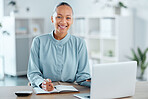 Modern, smiling and young business woman enjoying her work in a office at a computer indoors. Portrait of a happy junior corporate lawyer working, making notes and planning a successful job strategy