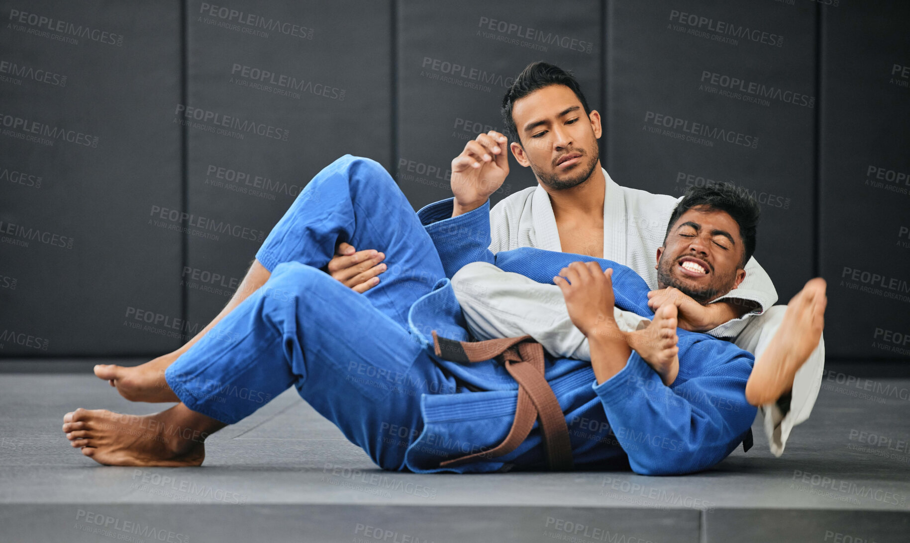 Buy stock photo Men fighting in karate competition, coach training student at fitness class and learning martial arts at sports club together. Strong trainer doing health exercise with male and showing self defense