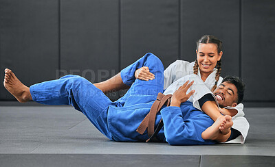 Karate, judo and aikido fighters fighting to win in martial arts fight competition to train or practice skills. Winning competitive female or athlete in match with submission self defense technique