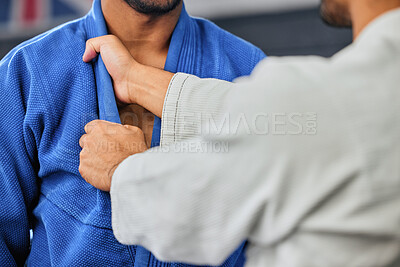 Buy stock photo Mma, fighting and martial arts with a teacher or instructor showing a student a grip or hold with his hands in a fight studio or sports gym. Closeup of a training workout in an exercise class