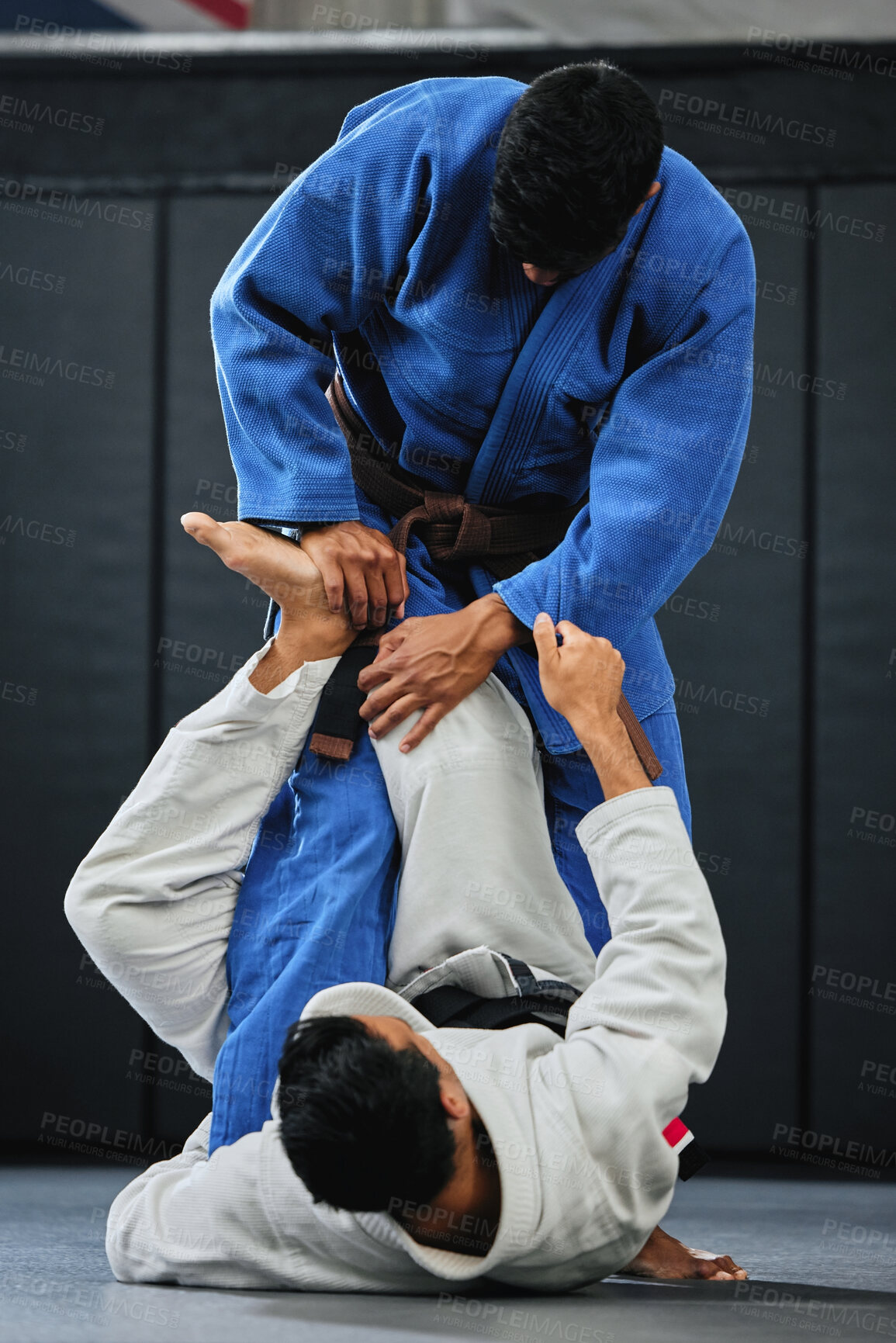 Buy stock photo Karate, fitness and exercise of a student training with a coach and learning in a contact sport. Man with personal trainer in martial arts sports fight for safety, wellness and health in a gym.