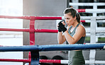 Boxing, fist and athletic woman uses the gym to practice her speed. Focused, powerful and strong lady that is active and sporty. Fit female training in the fighting ring to prepare for a match.