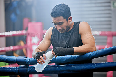 Buy stock photo Sad, lose and defeated athlete looking tired after workout, unhappy and drinking water after boxing for fitness. Young, sporty and Asian man breathing heavily, resting and taking break from exercise