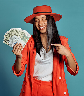 Buy stock photo Rich young woman holding cash, competition or lottery winnings pointing looking stylish, elegant and trendy. Happy, excited and celebrating female cheering with income, savings or investment returns