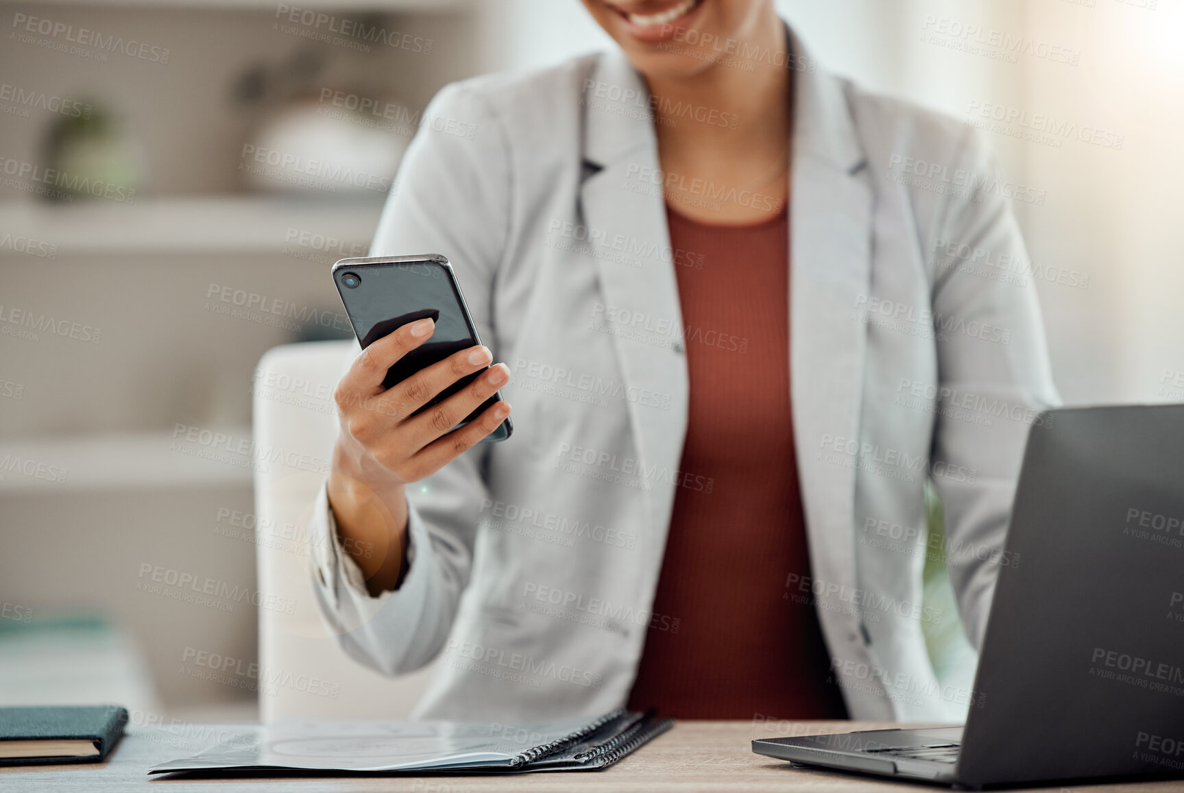 Buy stock photo Business woman texting, browsing and reading a notification on her phone while scrolling on social media in an office. Entrepreneur checking messages, apps and web while networking online at her desk