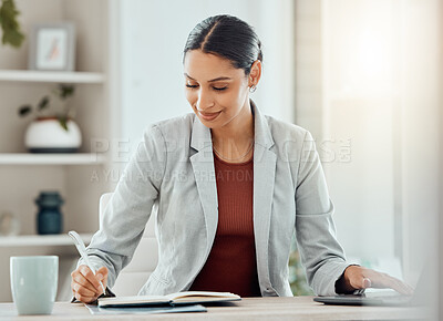 Buy stock photo Female manager, boss or CEO writing notes in her diary, marking appointments in her calendar or organizing a schedule. Corporate professional feeling motivated and working at her desk in the office